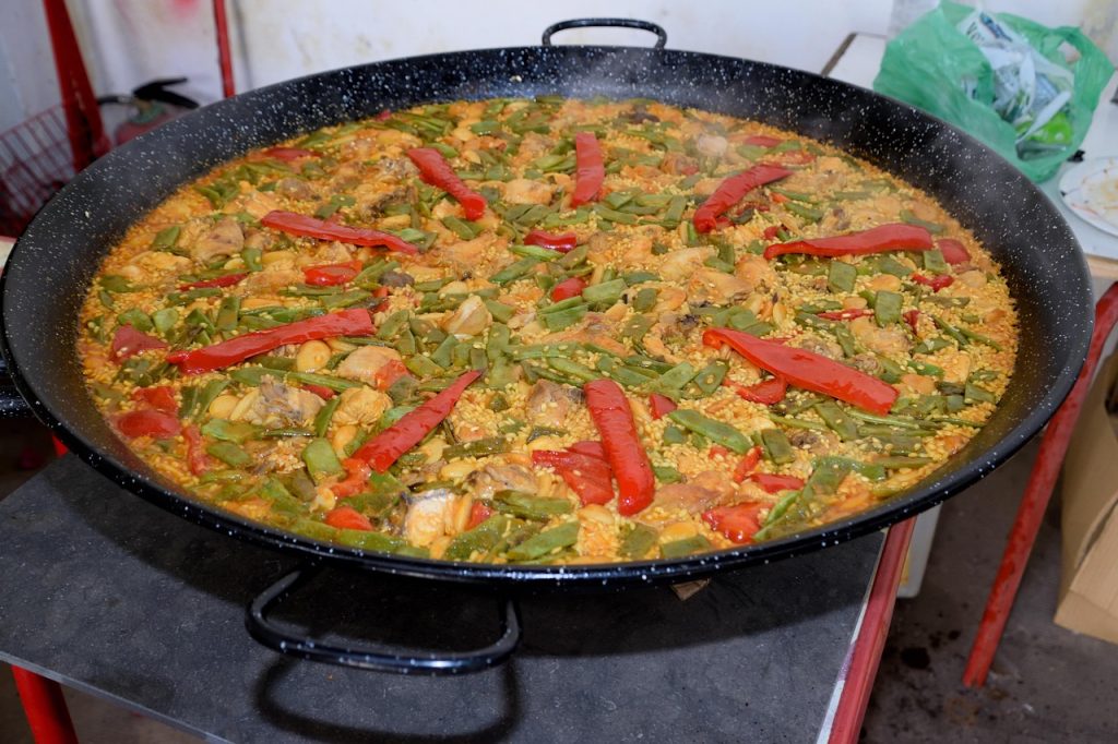 discover the rich flavors of traditional spanish paella, a delicious rice dish packed with fresh seafood, meats, and vibrant spices. perfect for sharing at gatherings or family meals.